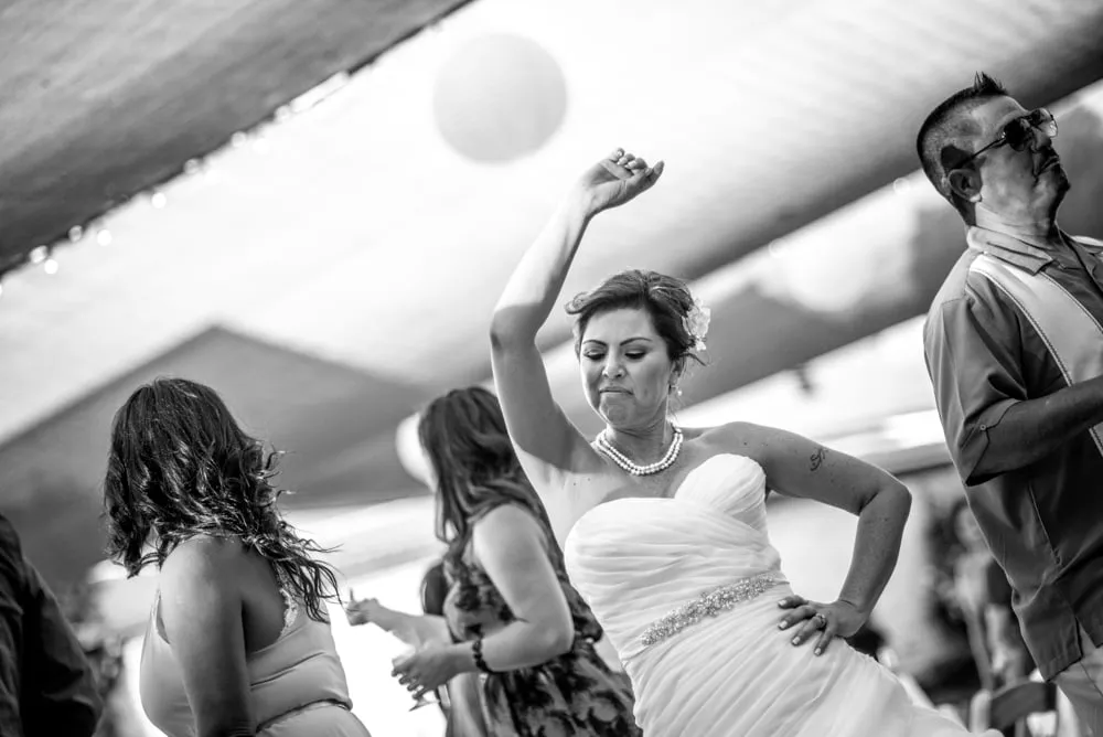 Wedding guests dancing, black and white