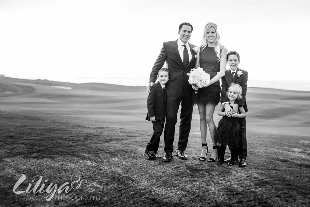 Family portrait on the beach, black and white
