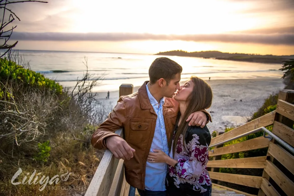 Couple kissing on the coastal steps