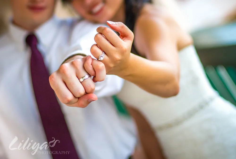 Wedding rings and joined hands